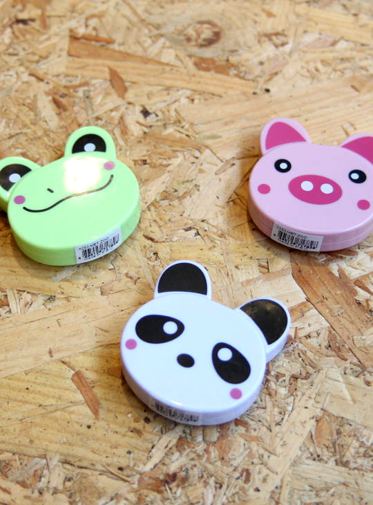 Assortiment of animal shaped tape measures by Sew Tasty. Animals on the photo are a frog, a pig and a panda